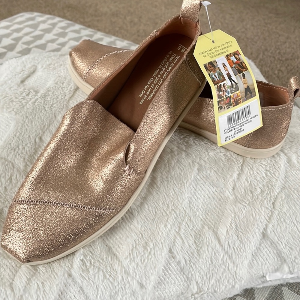 Brand new Leather metallic, rose gold Toms.  Sz 8.5